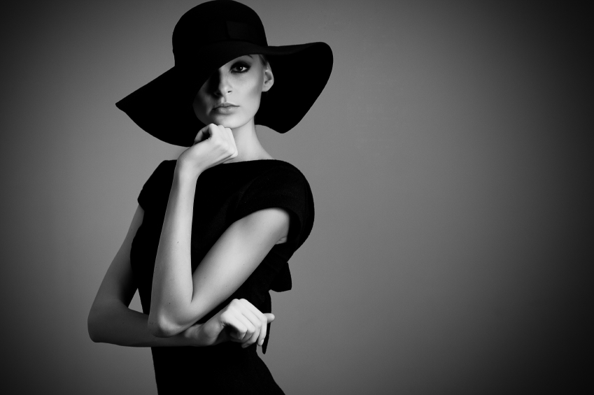 high fashion portrait of elegant woman in black hat