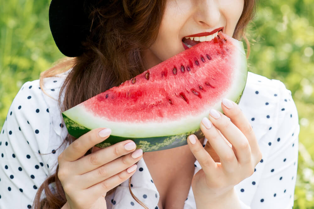 Woman eating watermelon