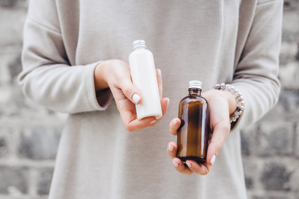 Woman holding skincare products