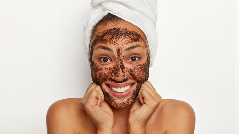 Woman with face scrub