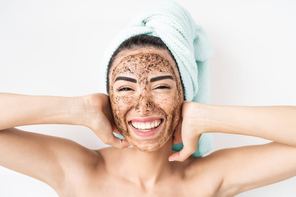 Woman with face scrub