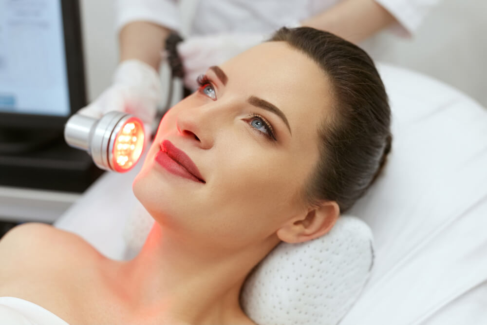 Woman having LED treatment