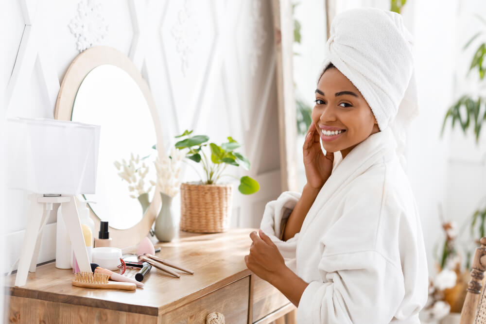 Woman using skincare to de-stress for your skin
