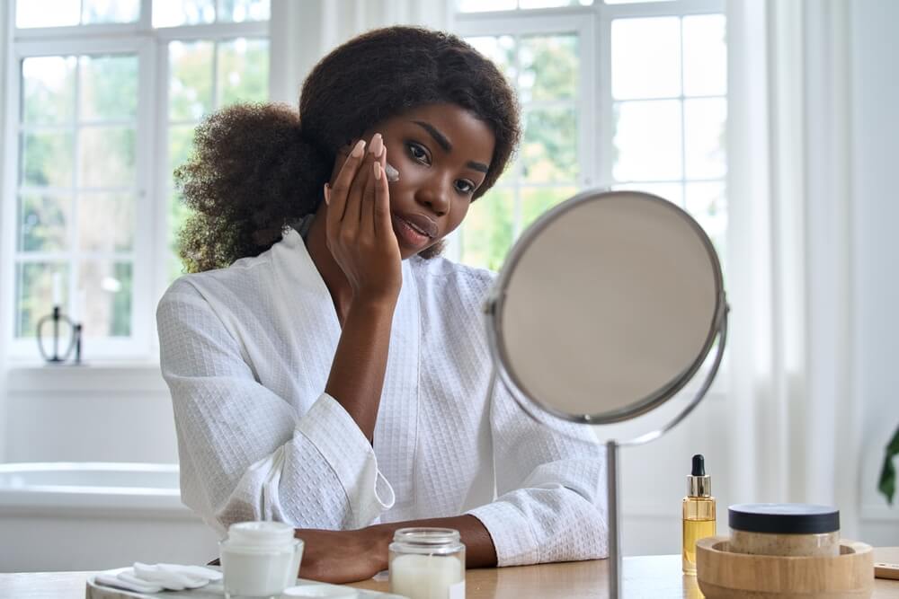 Woman applying face cream