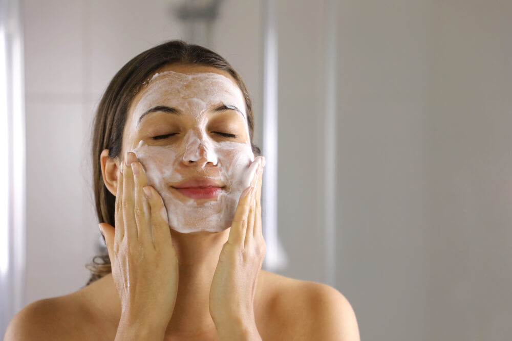 woman washing face