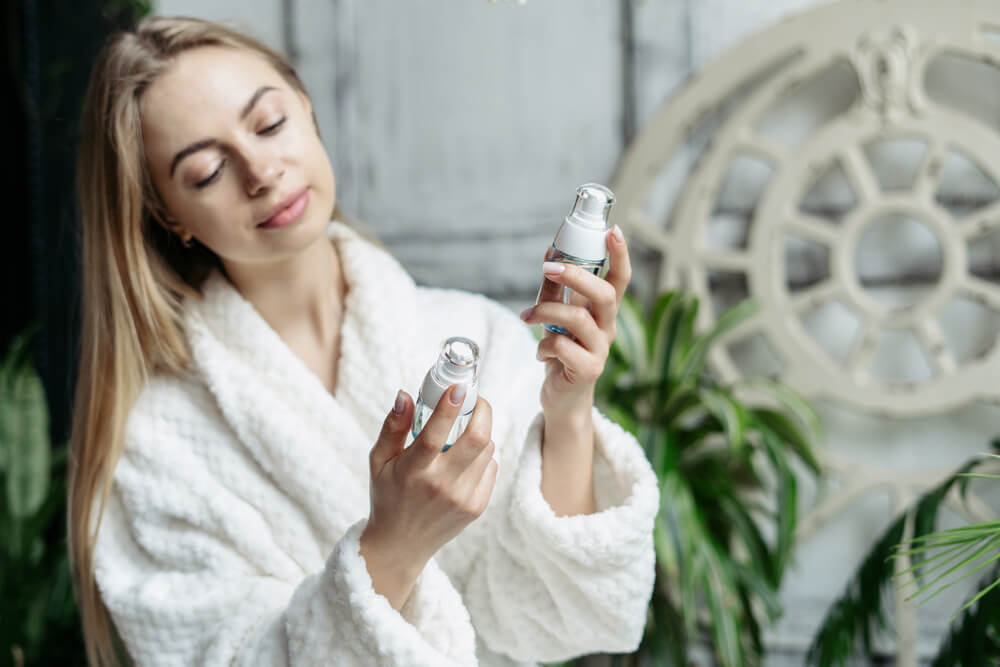 woman looking at skin products