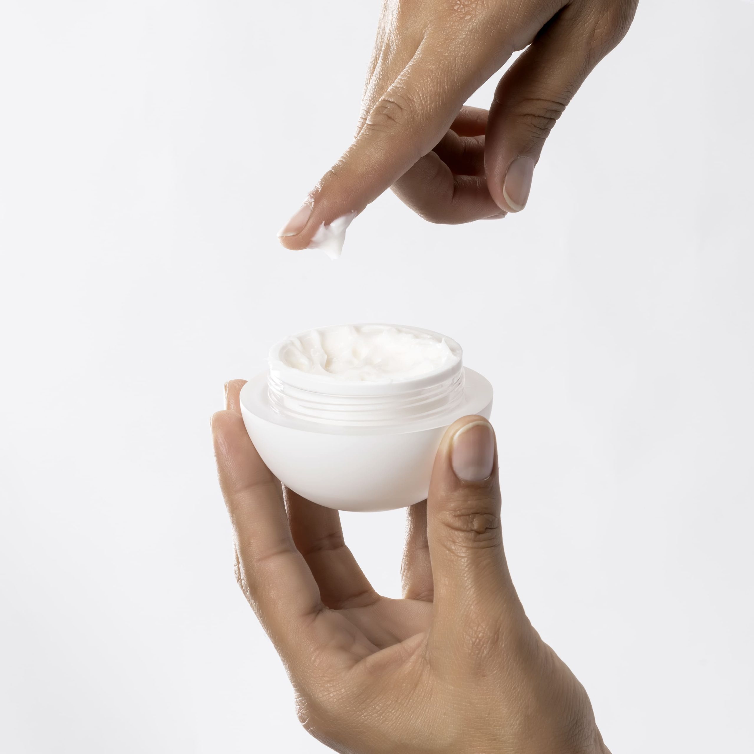 Woman using the OROGOLD 24K Overnight Cream