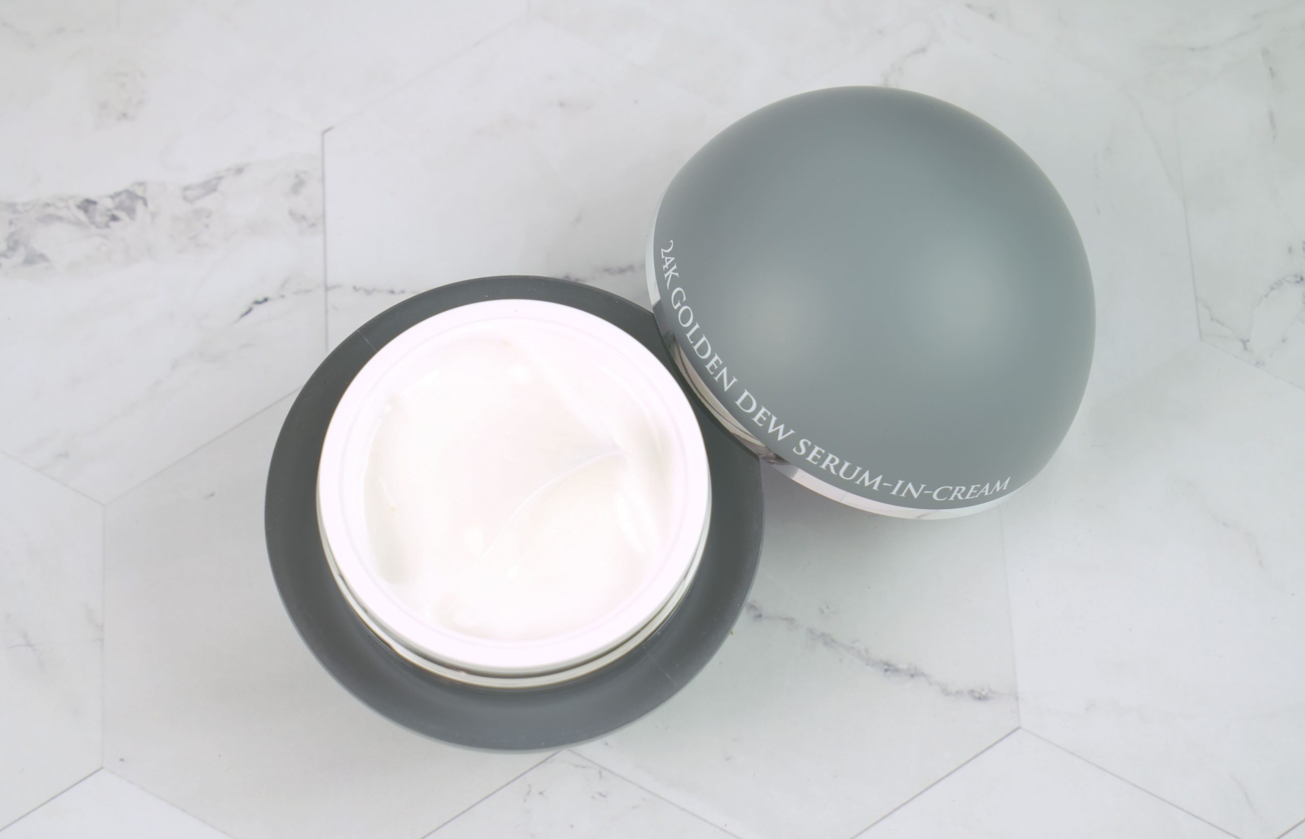 Open jar of OROGOLD Golden Dew Serum-in-Cream